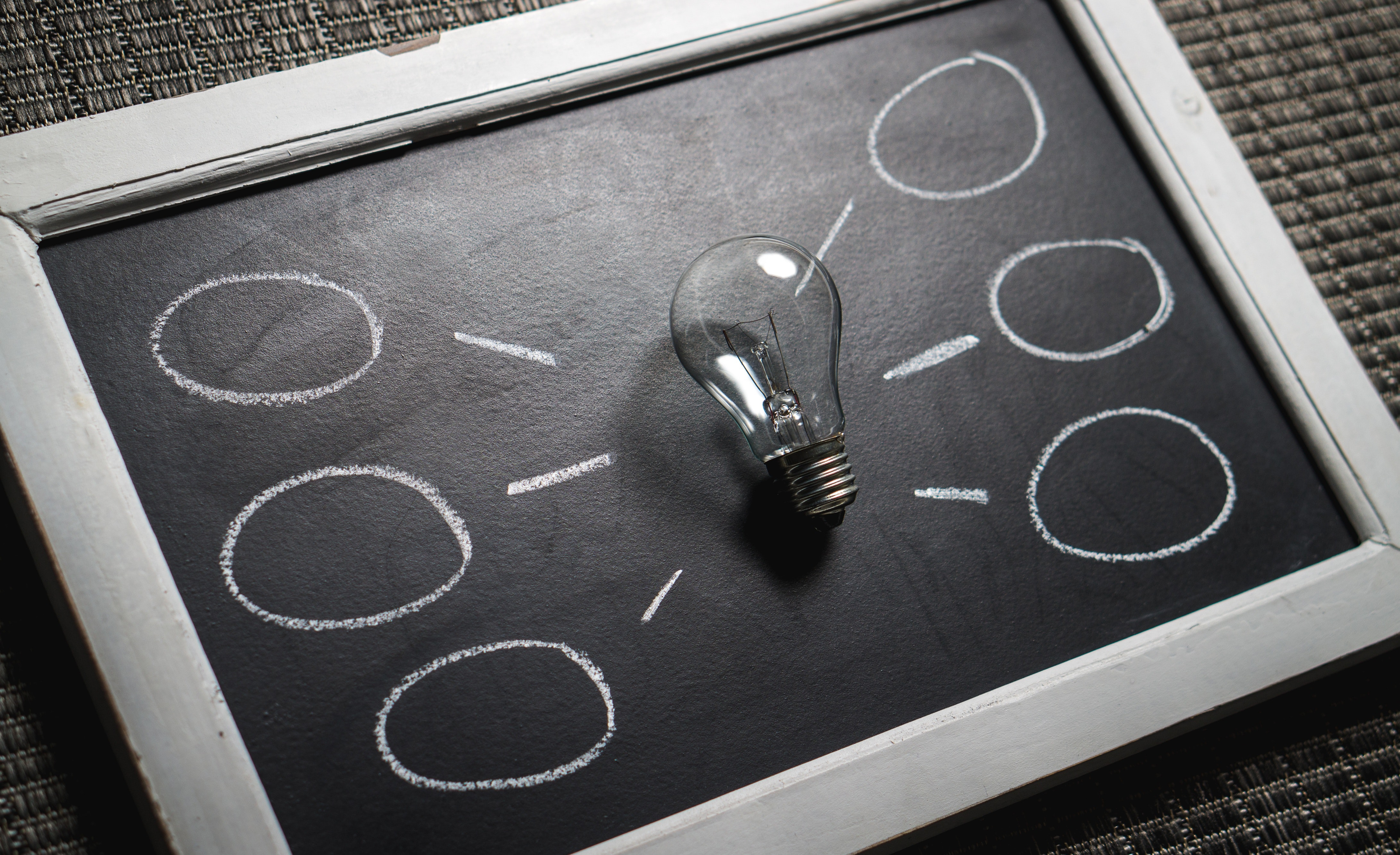 black and white chalkboard with light bulb drawing